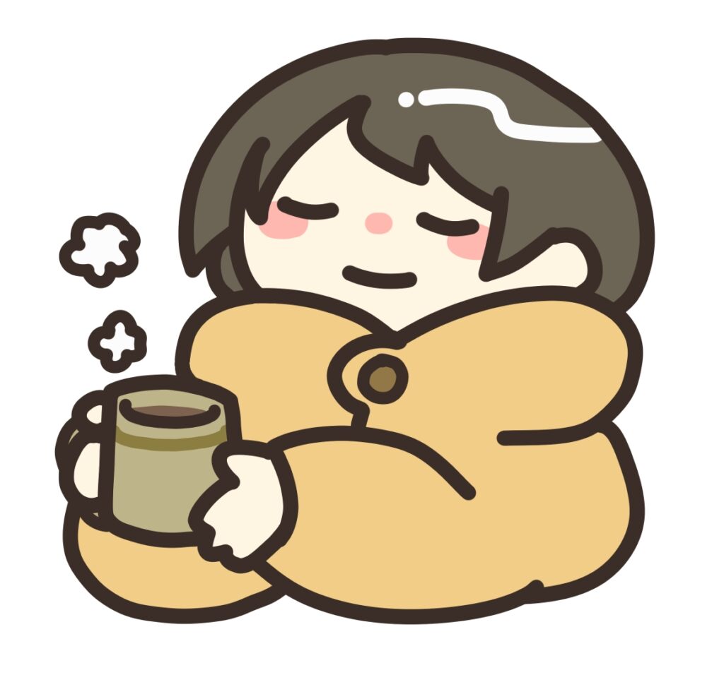 コーヒーで温まる女性